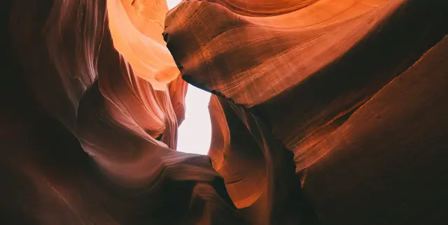 Flowing, warm sandstone walls of a canyon, reflecting the deep emotional safety of Emotionally Focused Therapy.